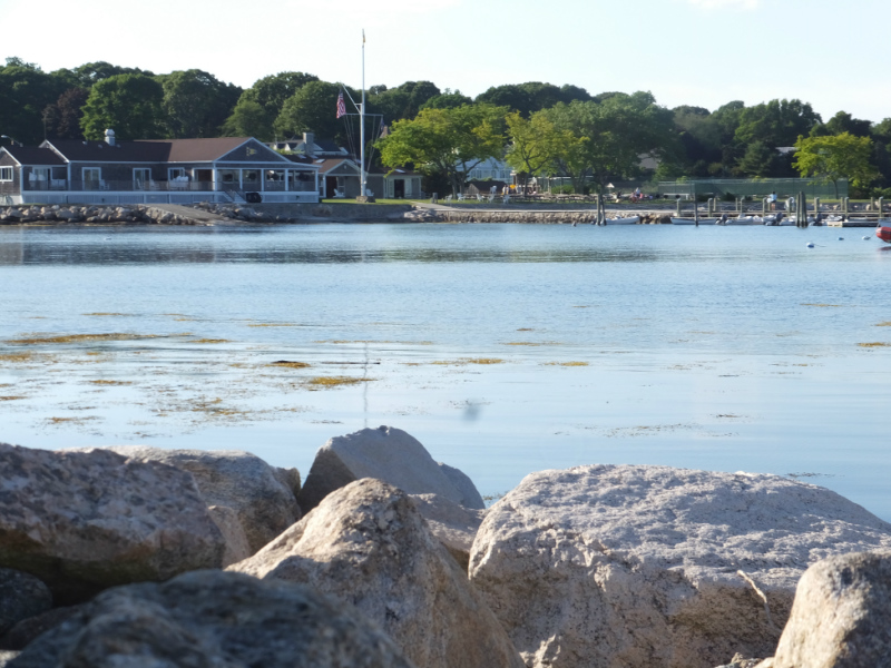 Beautiful view of Masons Island, a private gated community in Stonington, CT, showcasing waterfront properties and lush landscapes along Fishers Island Sound.